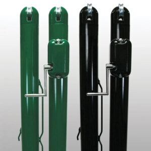 Four tall gas cylinders standing upright, two green on the left and two black on the right, each with a metal regulator and support frame.